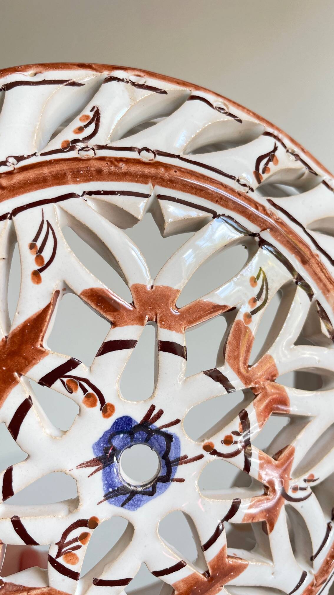 Handmade terracotta wall lamp with blue enamelled center