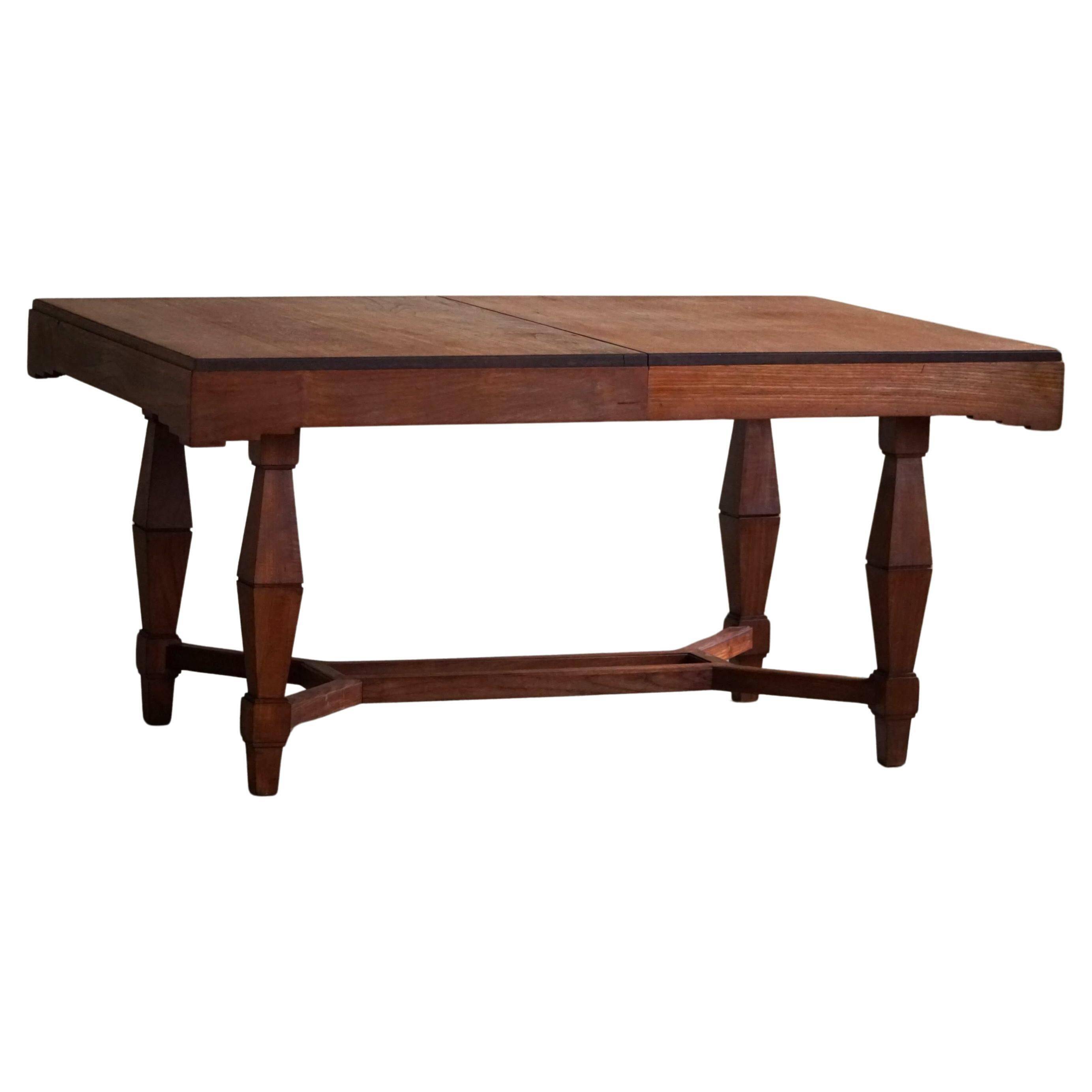 Art Deco dining table in teak, with butterfly extension, Danish cabinetmaker, 1940s.