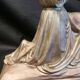 Statuette of a woman in gilded cast iron (Joan of Arc?)