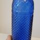 Vintage decanter bottle made of blue molded pressed glass