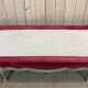 Louis XV style daybed in painted wood and covered with a red velvet