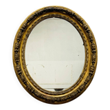 Large golden oval mirror