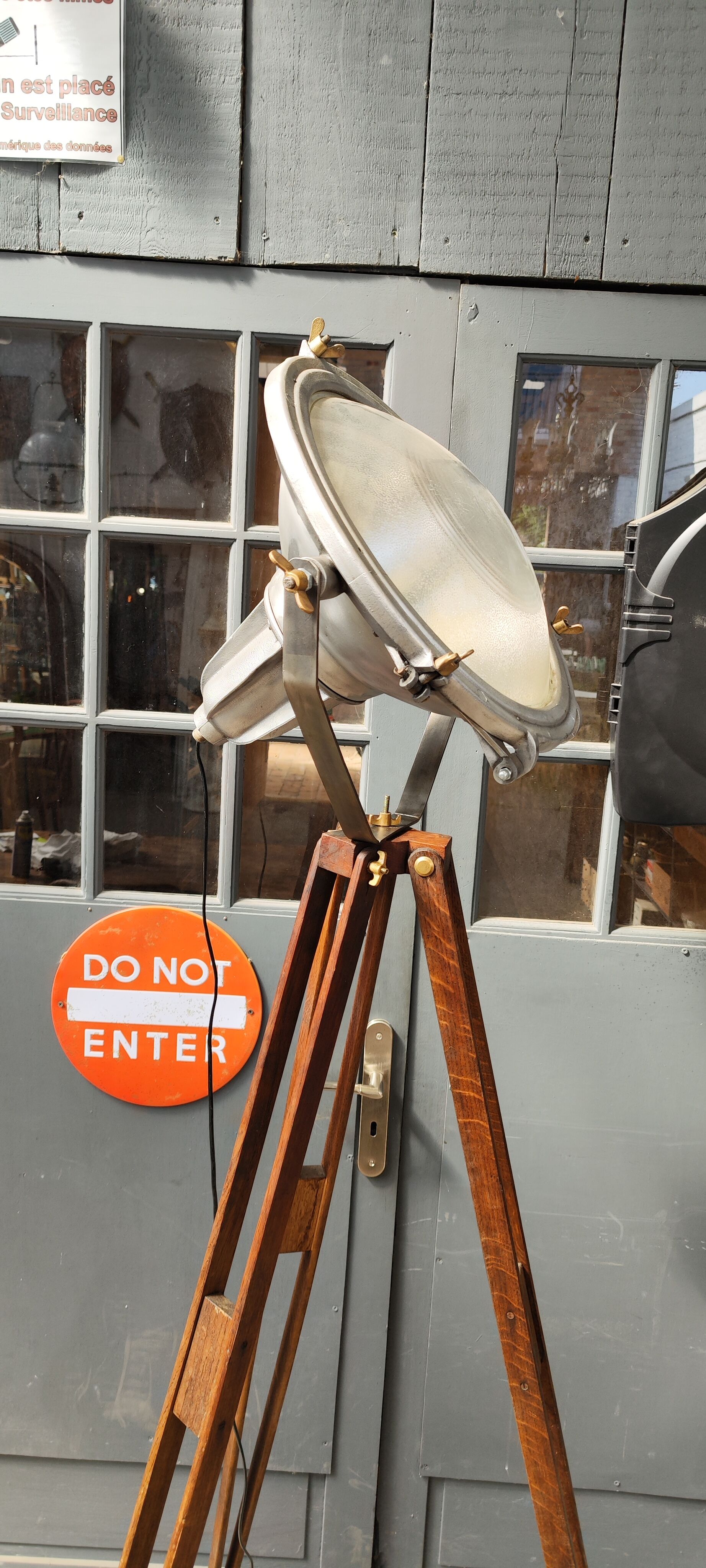 Industrial projector on tripod waxed wood