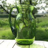 Green water jug in blown glass
