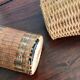 Set of three vintage rattan bottles