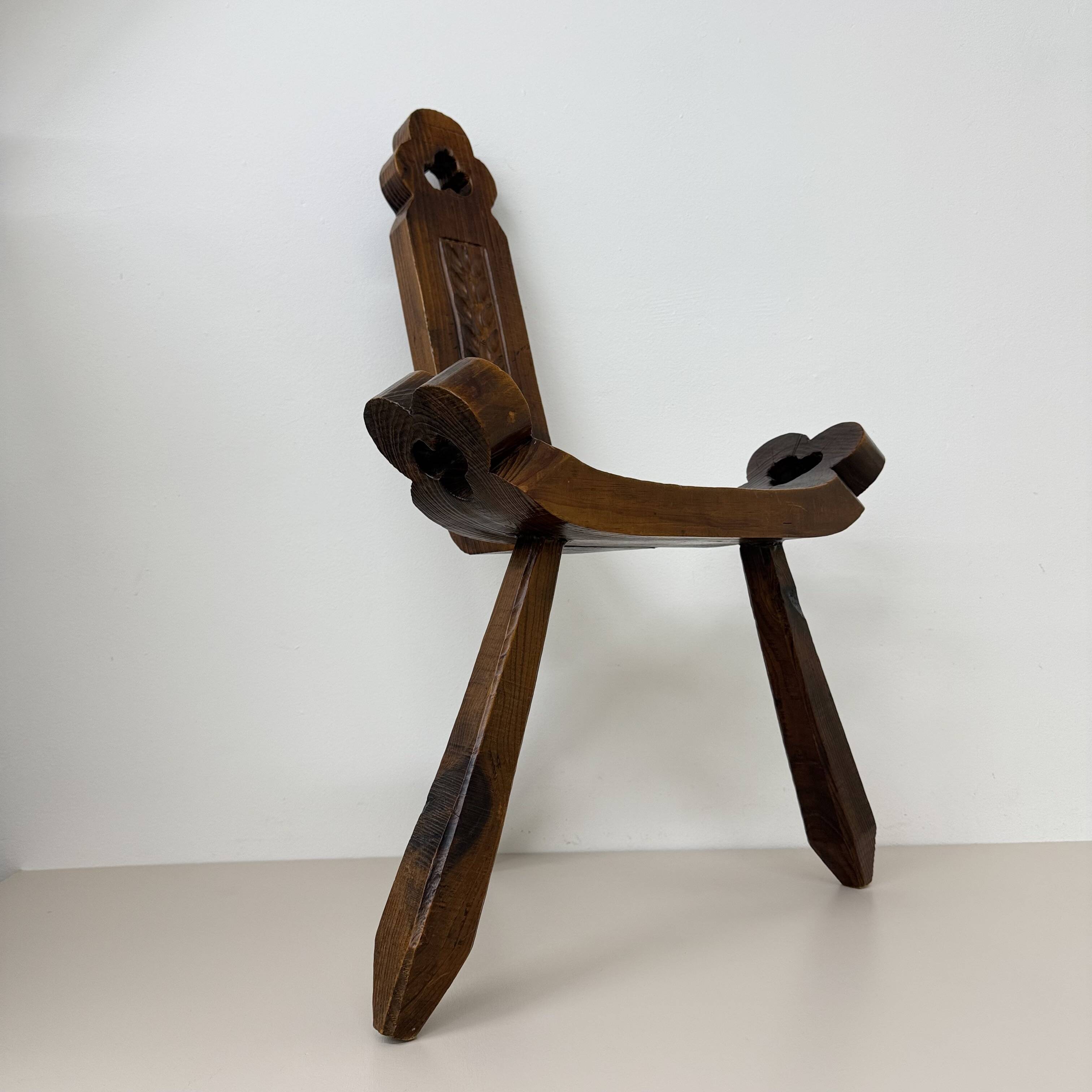 Brutalist hand carved oak Spanish tripod chair , 1970s