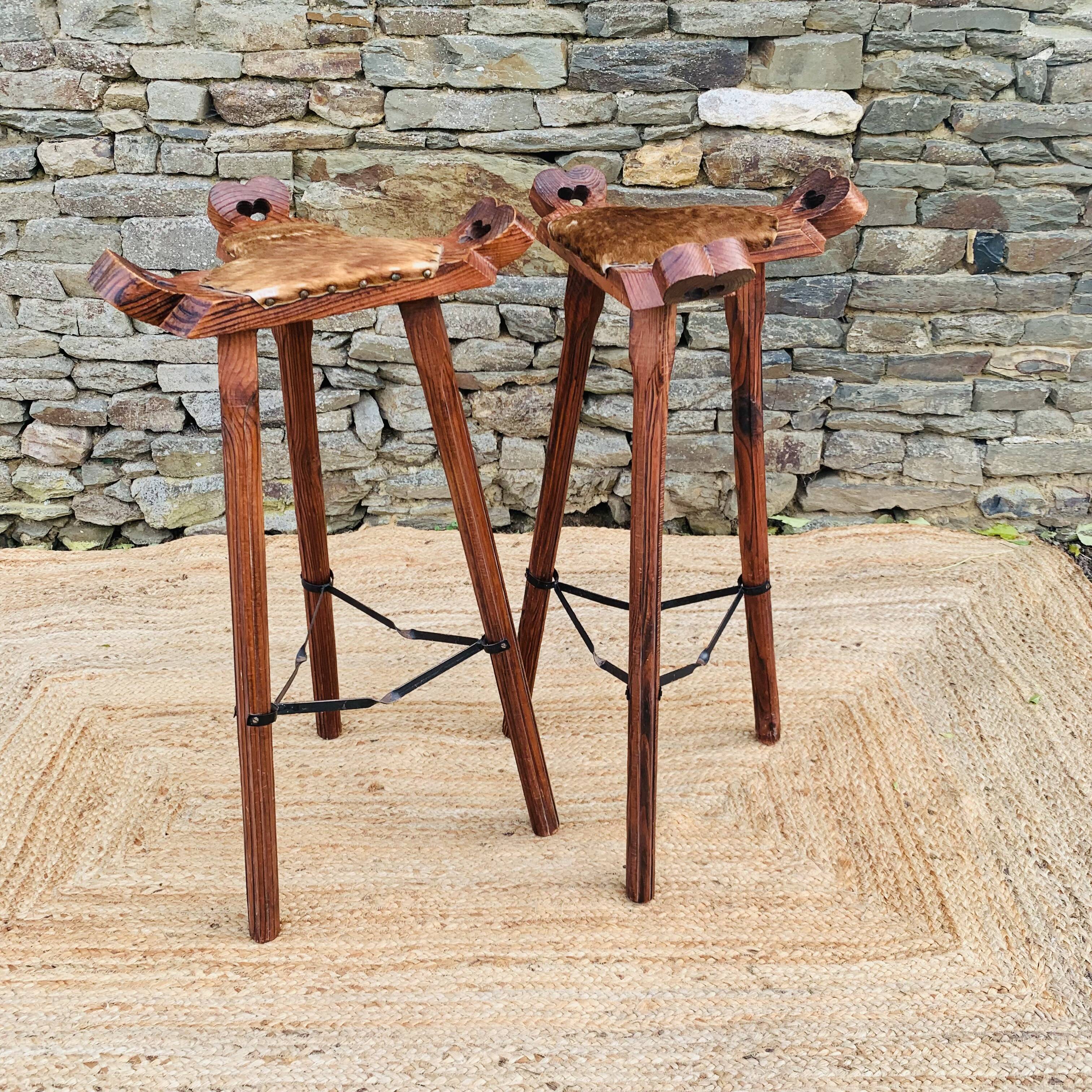 Set of 2 vintage high stools in cowhide and wood