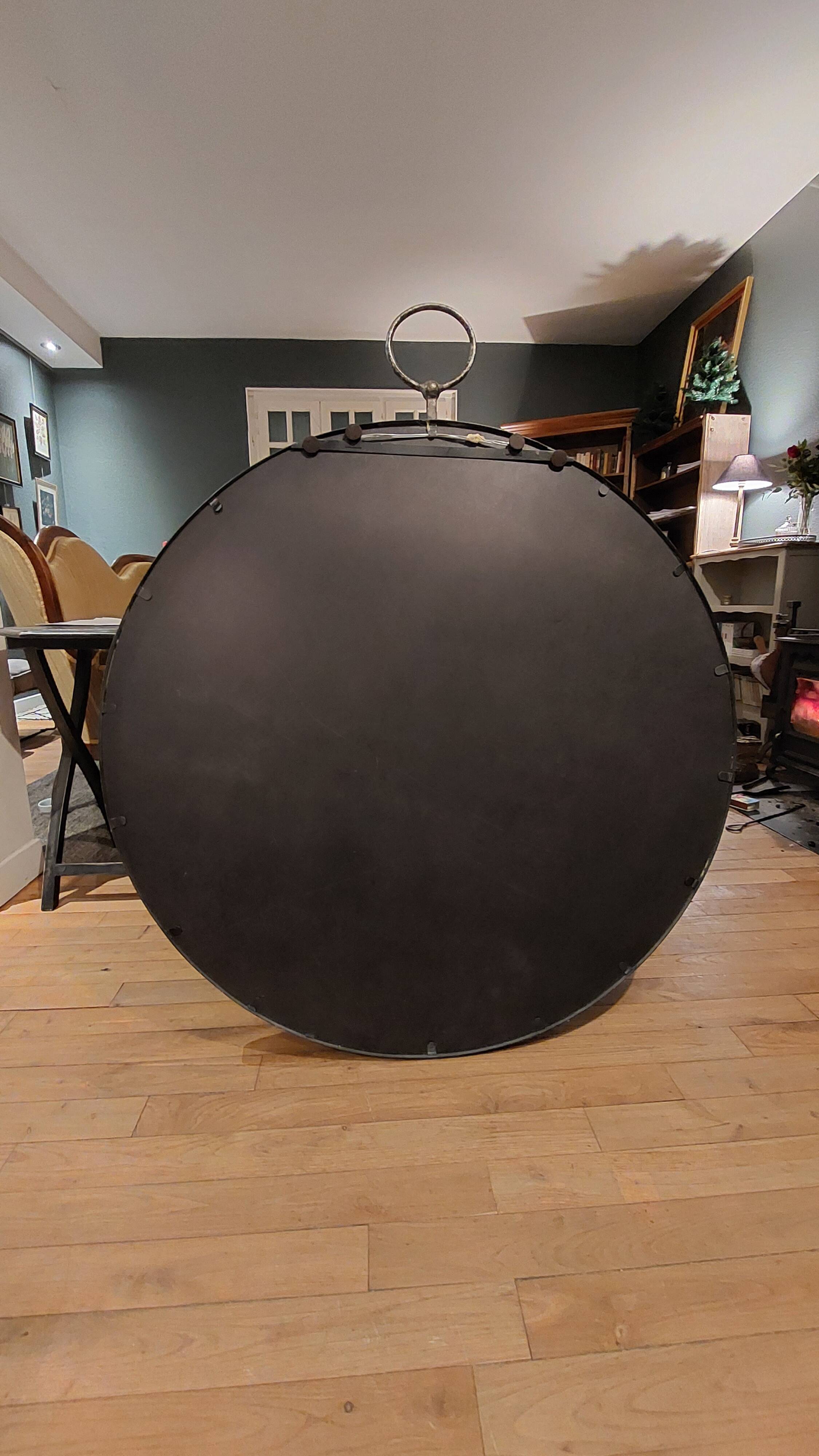 Round patinated mirror