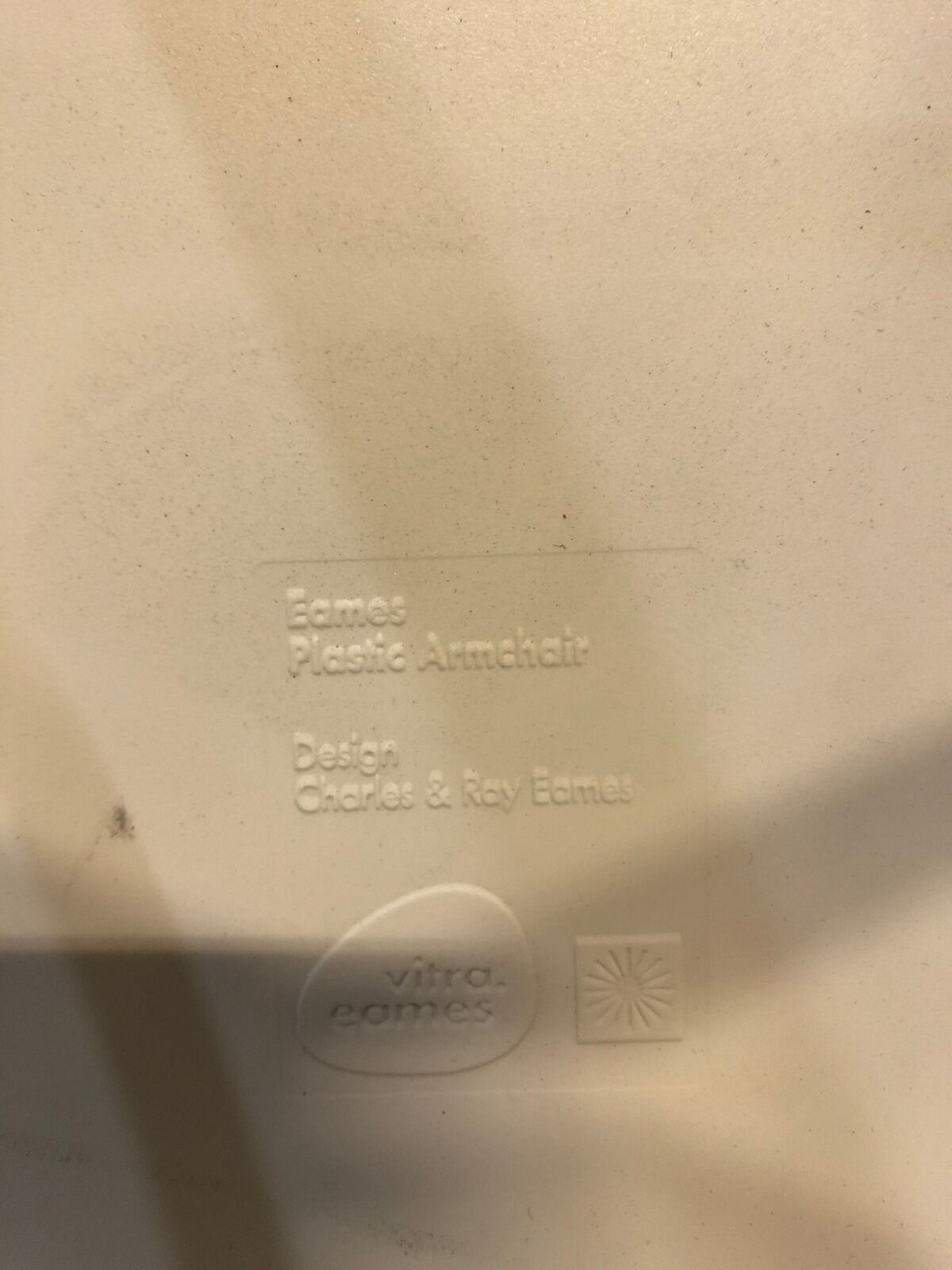 White DAW armchair by Charles & Ray Eames