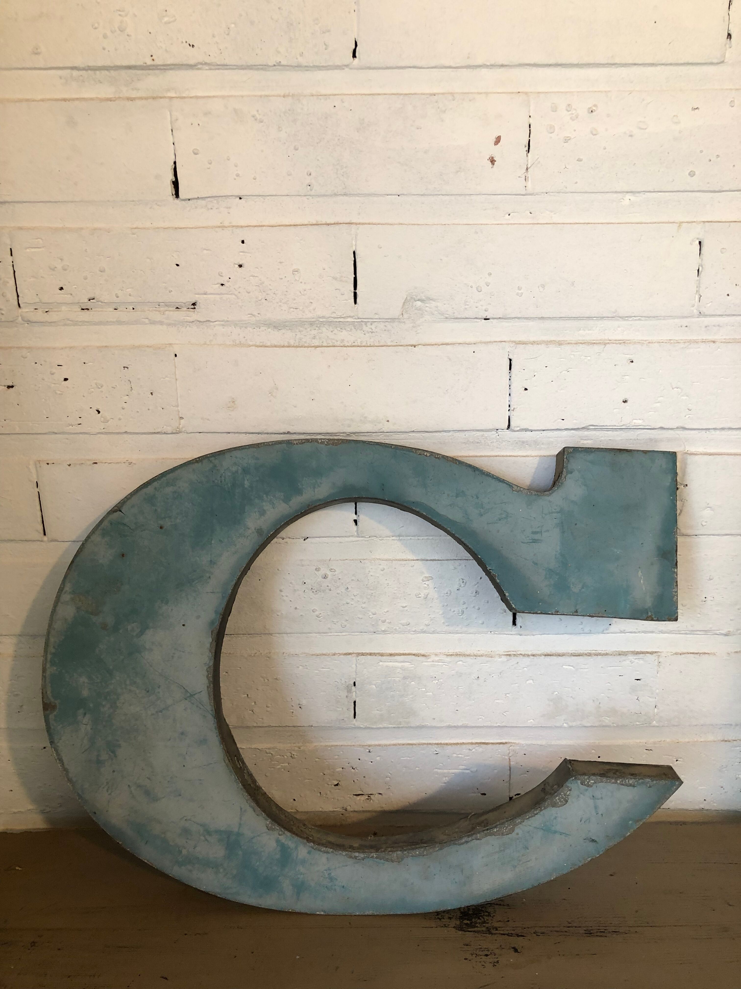 Blue sign letter "C"