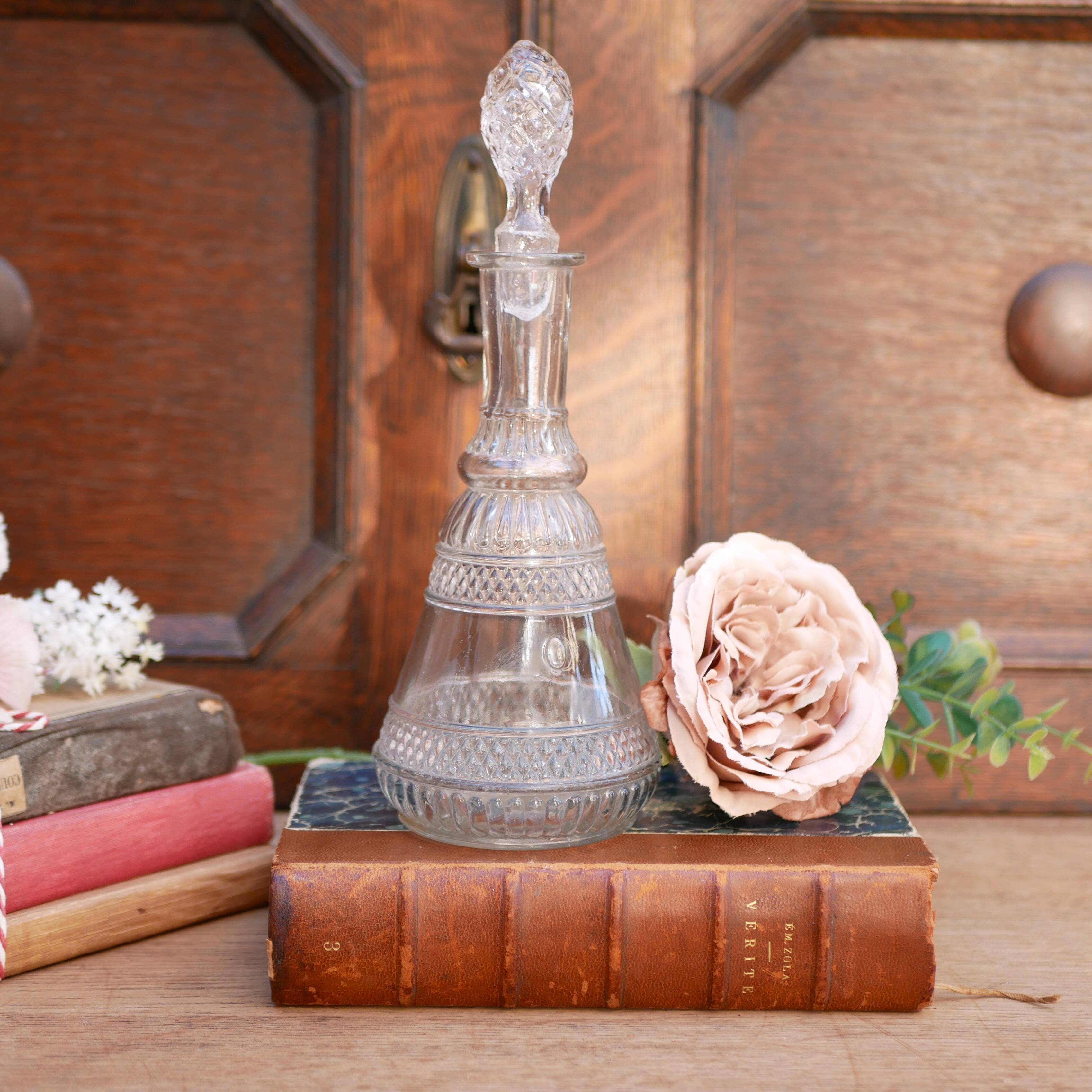 Cut glass liqueur decanter with decorated stopper