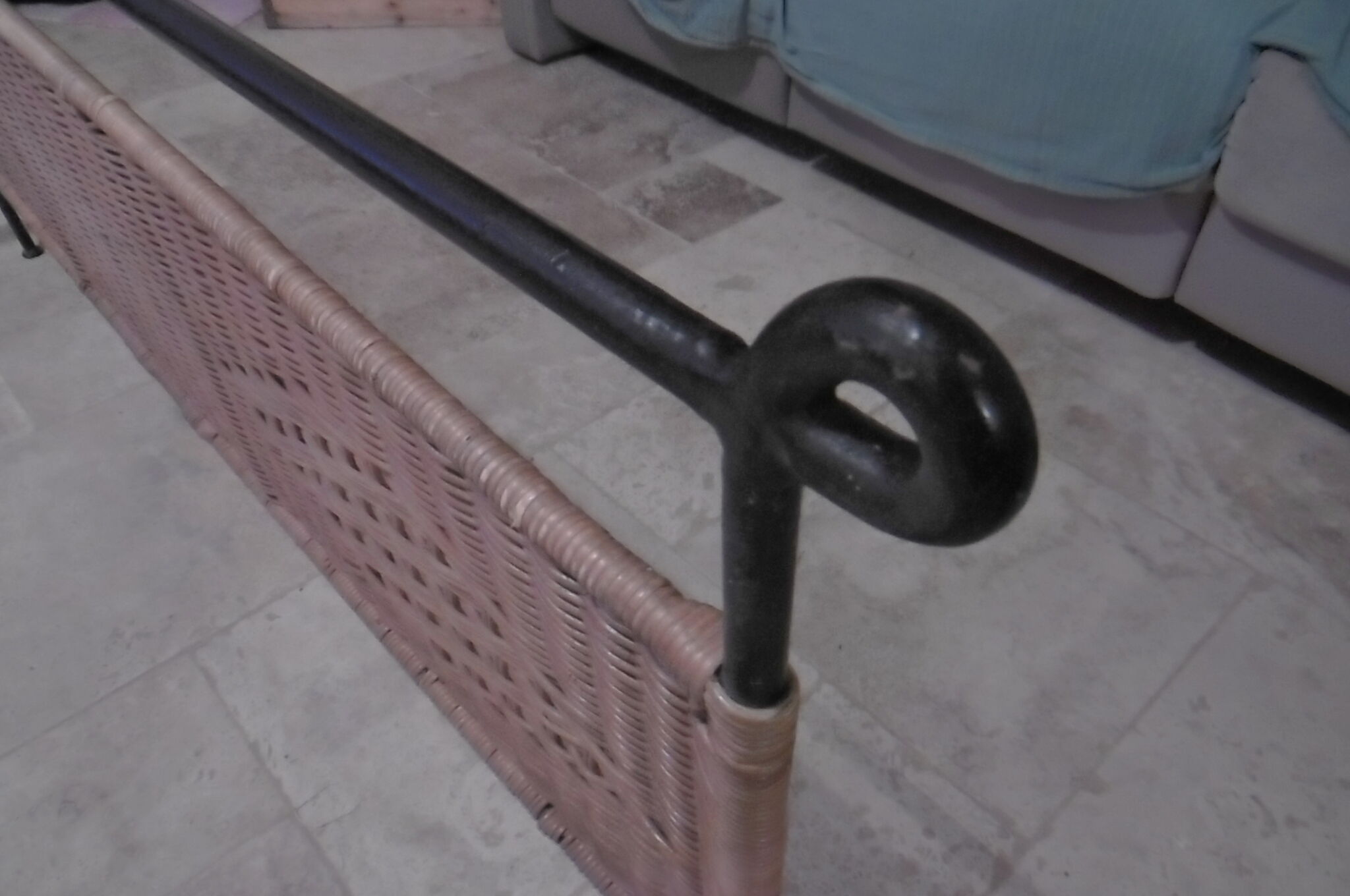 Black metal and rattan bed frame