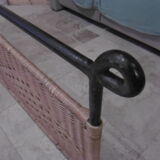Black metal and rattan bed frame