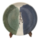 Glazed ceramic plate representation man between two lands unknown signature