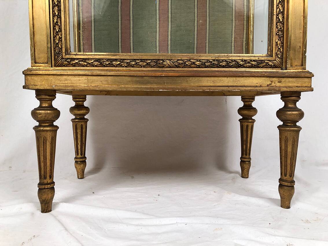 Louis XVI style showcase in wood and gilded stucco, circa 1900