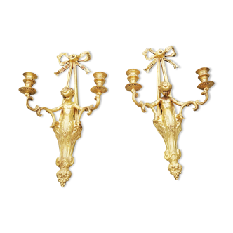 Pair of wall lamps decorated with cherubs