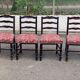 4 Henri II chairs in solid wood and floral burgundy fabric from the 19th century.