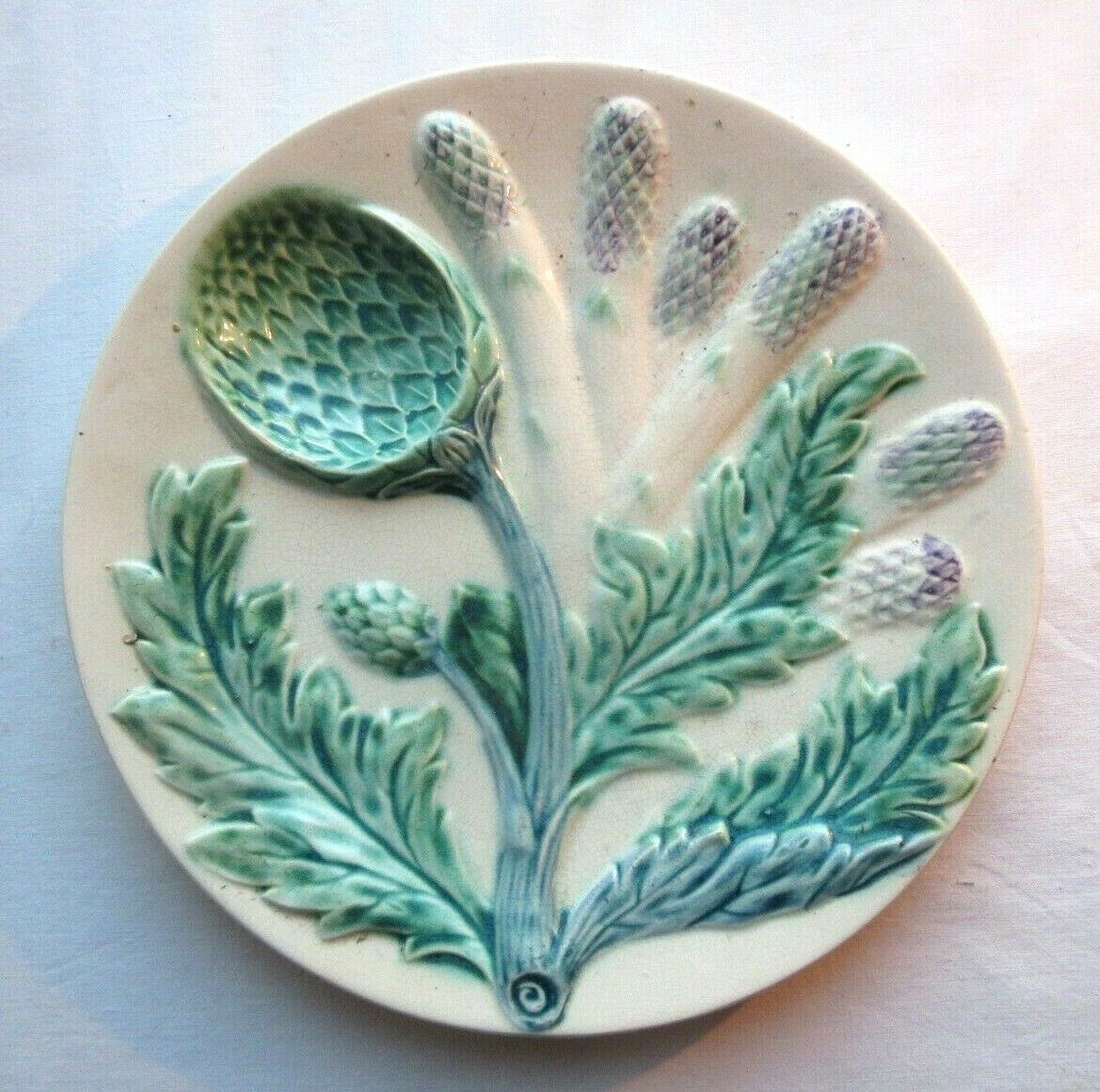 Plate of asparagus in splash of LUNEVILLE: Asparagus and Artichokes