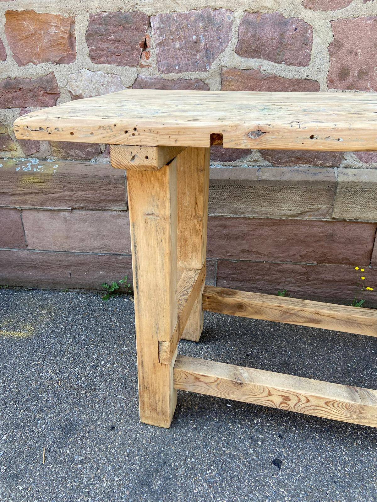 Primitive industrial table workbench in raw natural wood vintage bohemian trade store