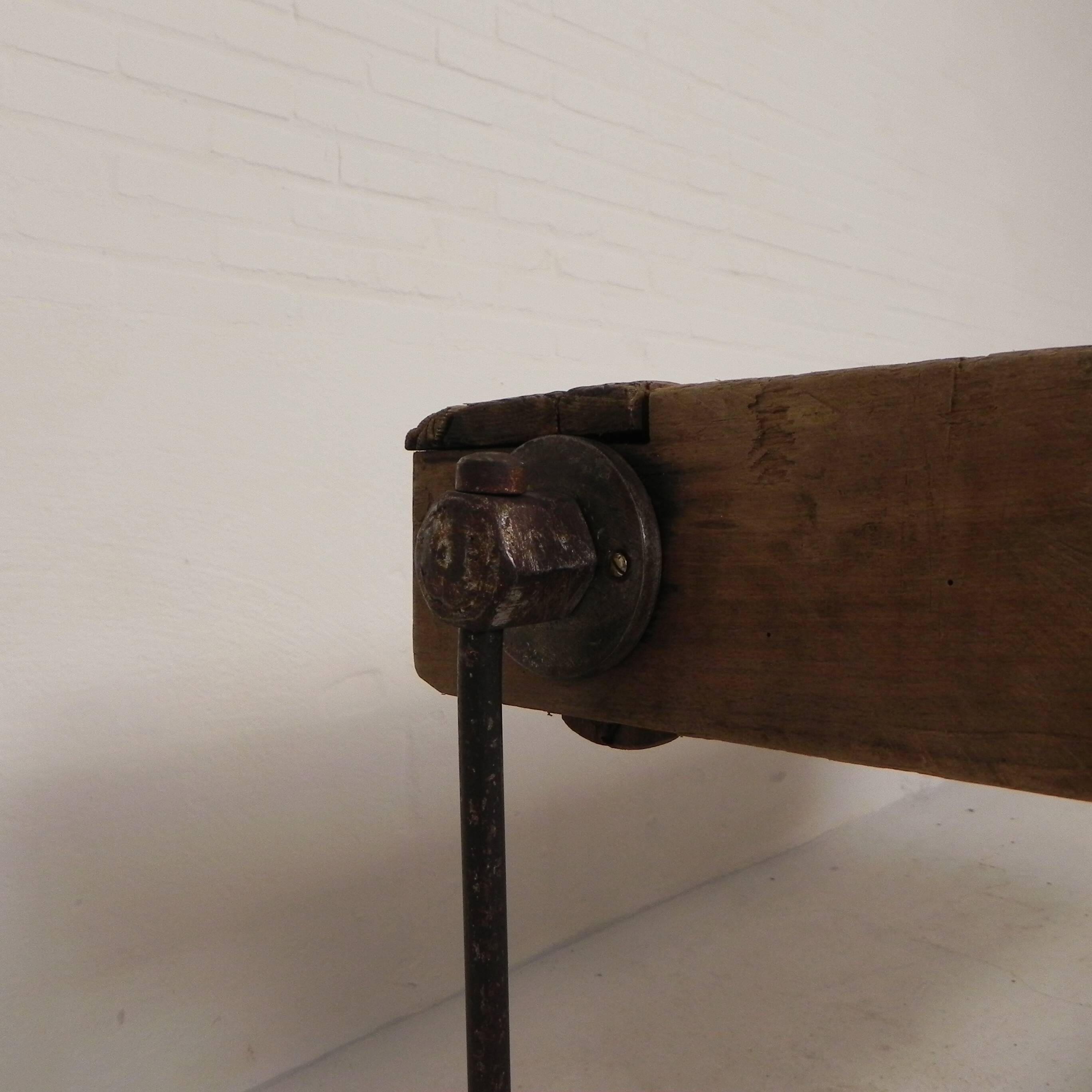 Wooden industrial workbench with vice, 194 cm long, 1930s.