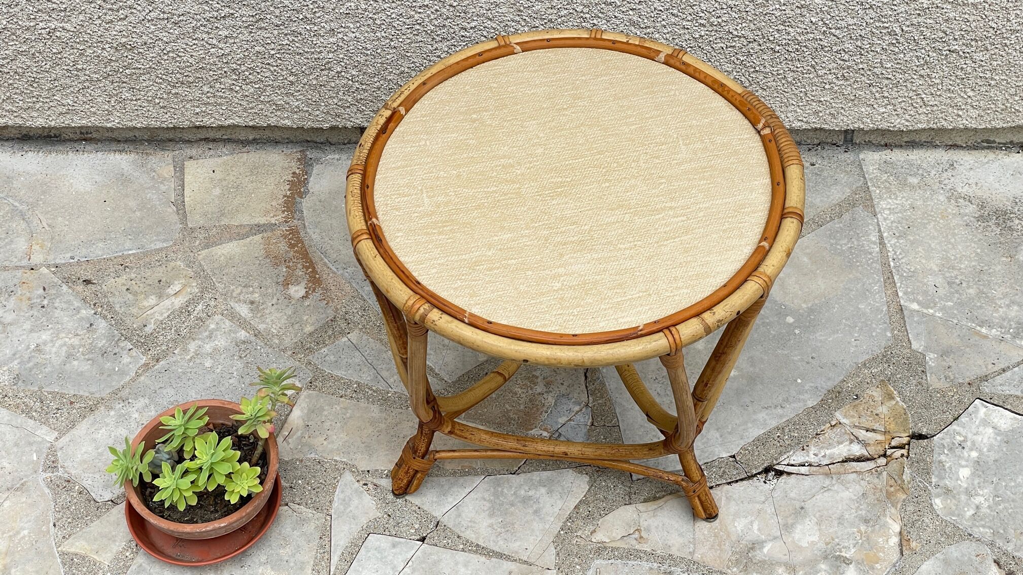 Round coffee table in vintage rattan