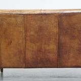 Charming 2-seater designer sofa made of sheep leather with a rustic look