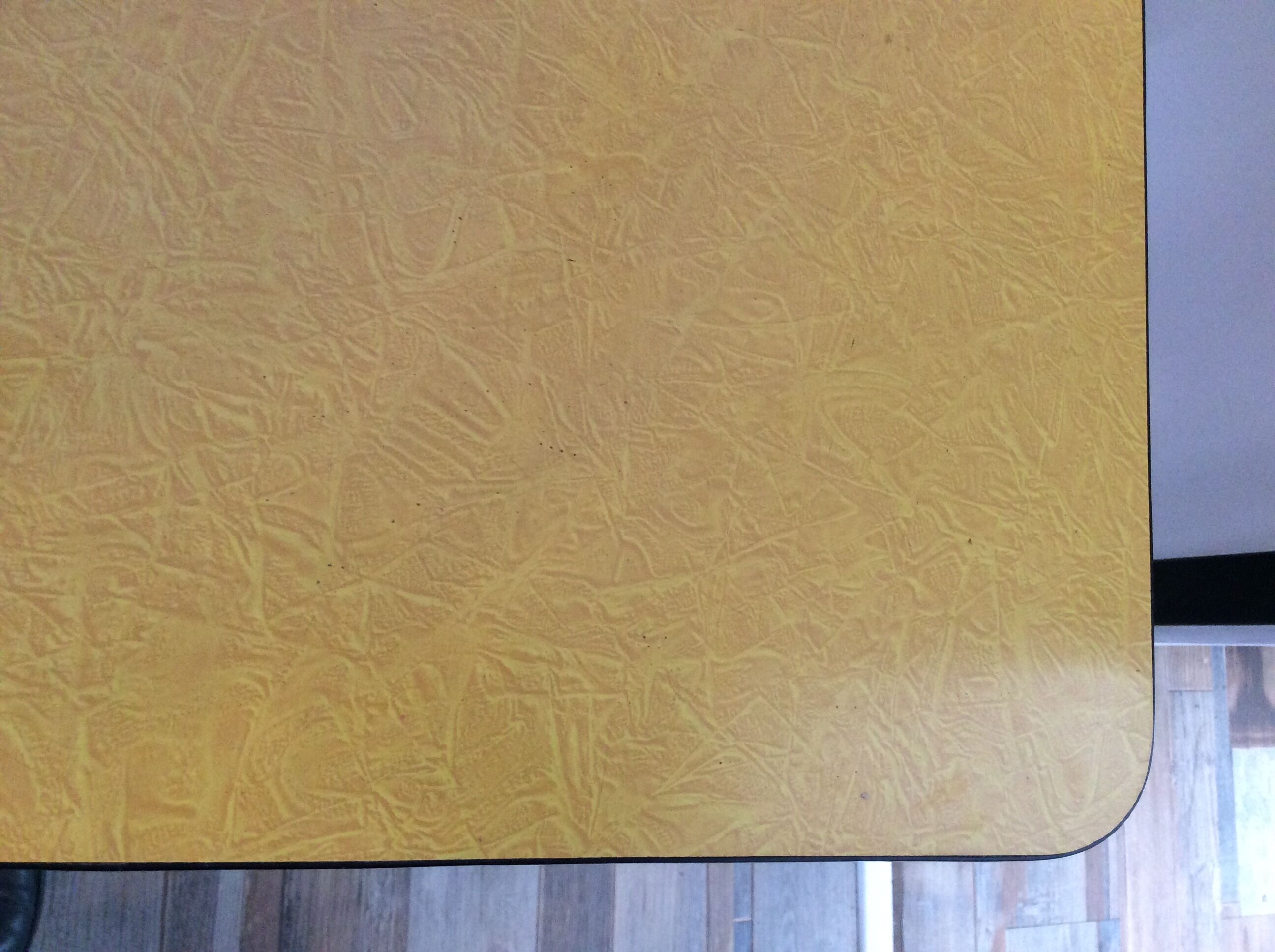 Wooden kitchen table and yellow formica