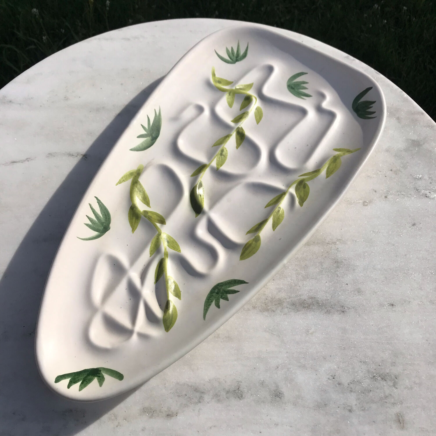 Vintage dish stylized leaf patterns
