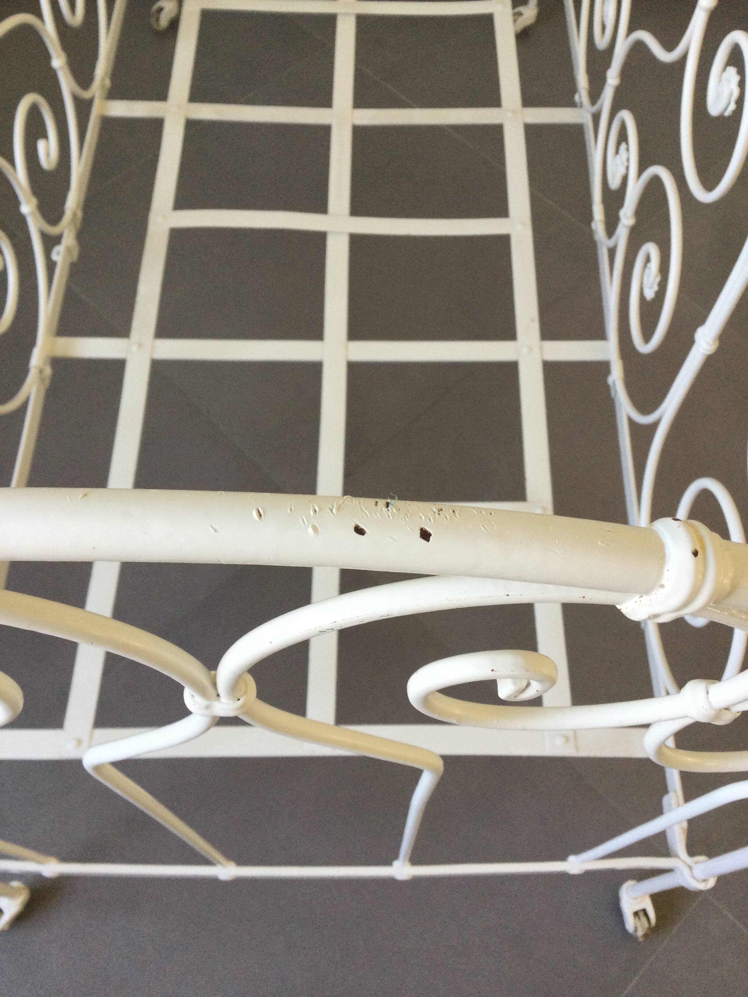 White wrought iron folding bed