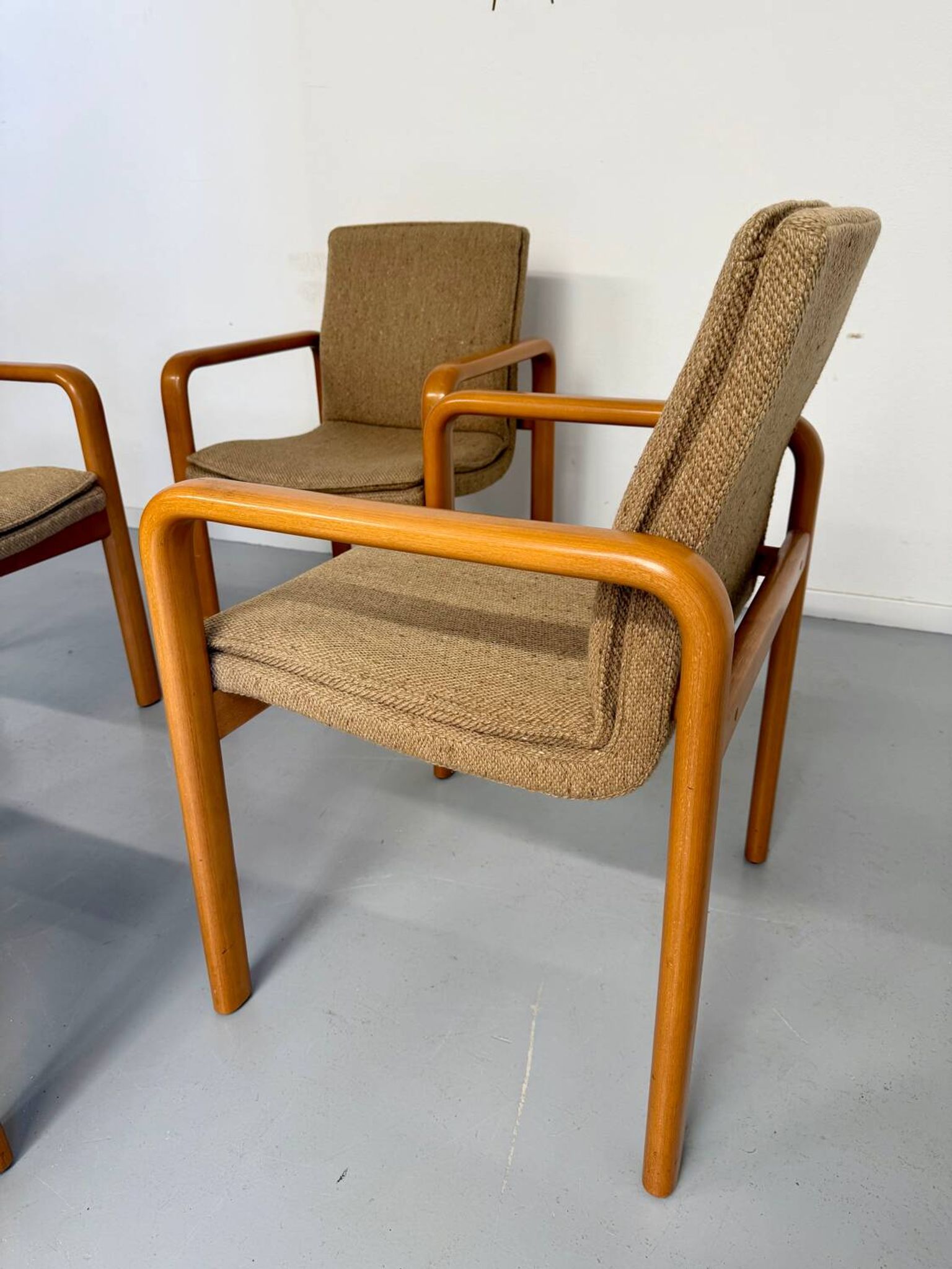 4 armchairs with armrests in beech and fabric, 1970s vintage design.
