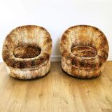 Pair of rounded armchairs in floral velvet
