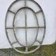 Bull's-eye window from the 19th century in iron (with opening).