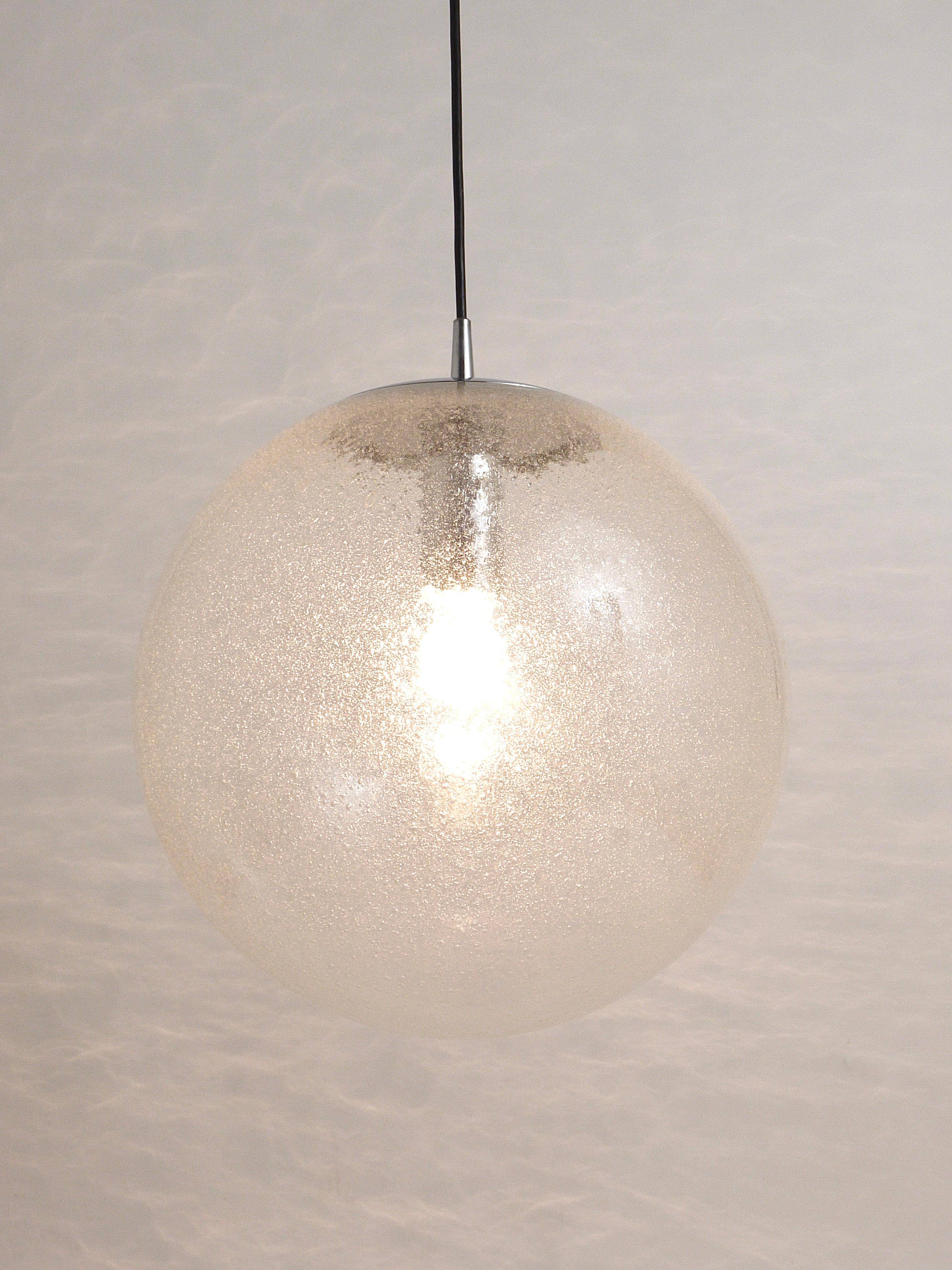Large glass globe pendant light with bubbles and chrome by Peil & Putzler, Germany, 1970s.