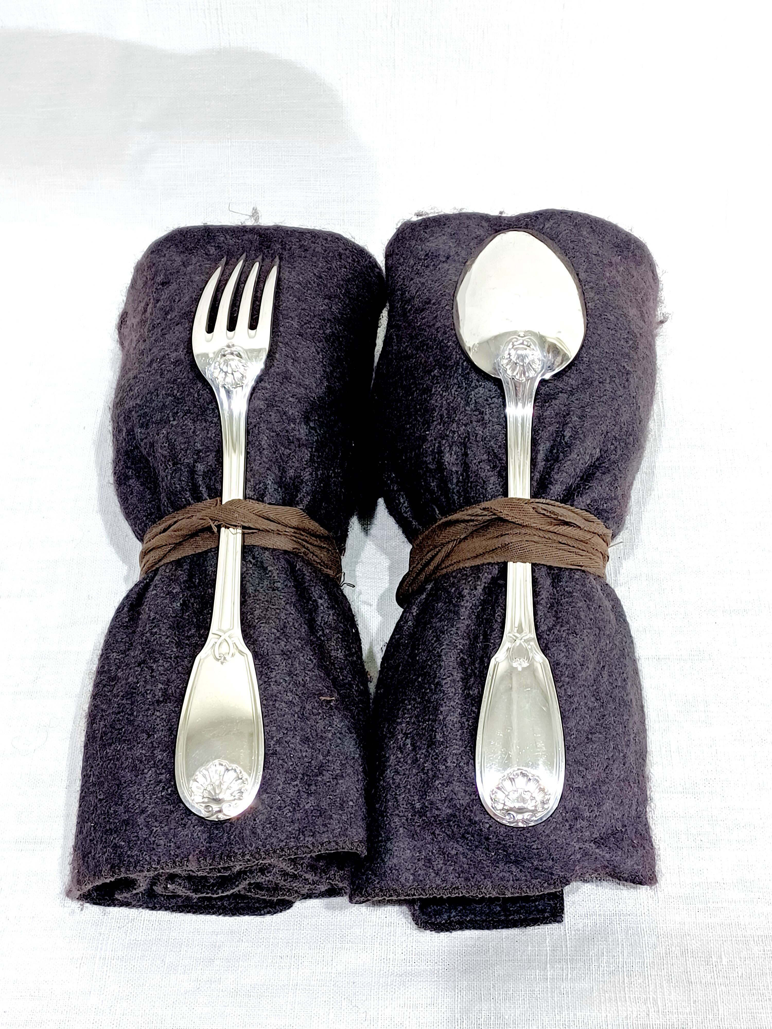 12 Louis XIV style silver cutlery sets