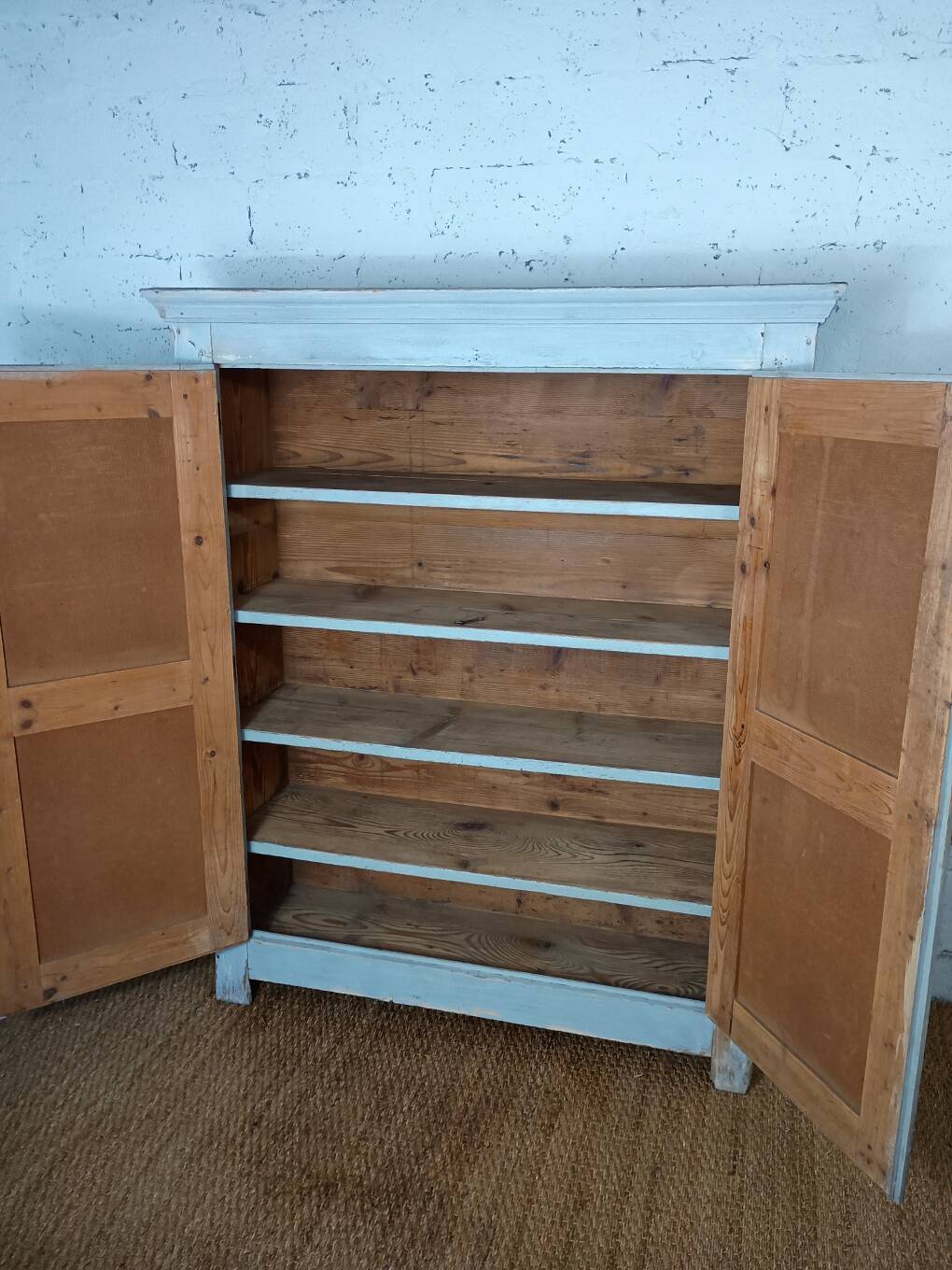 Low Parisian wardrobe with two doors, made of fir with original patina