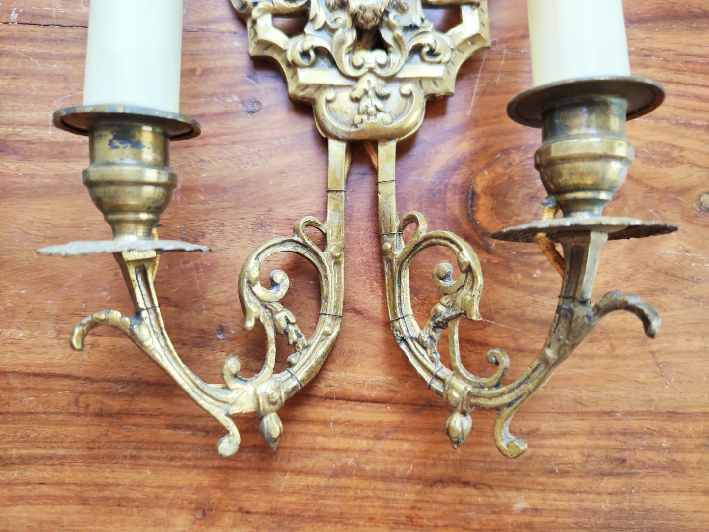 Pair of gilded bronze sconces decorated with Louis XIV style mascarons