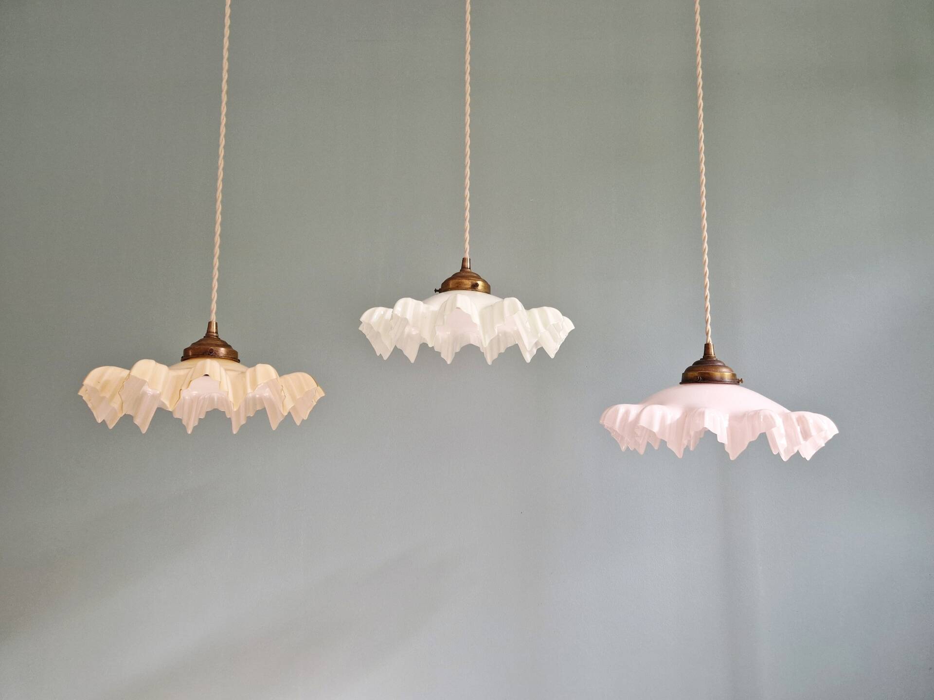 Art Deco trio of suspensions in coloured frilled opaline, 1920-30.