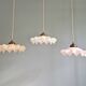 Art Deco trio of suspensions in coloured frilled opaline, 1920-30.