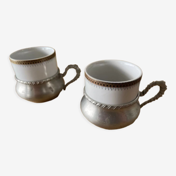 Two coffee cups with pewter stand