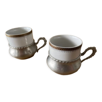 Two coffee cups with pewter stand