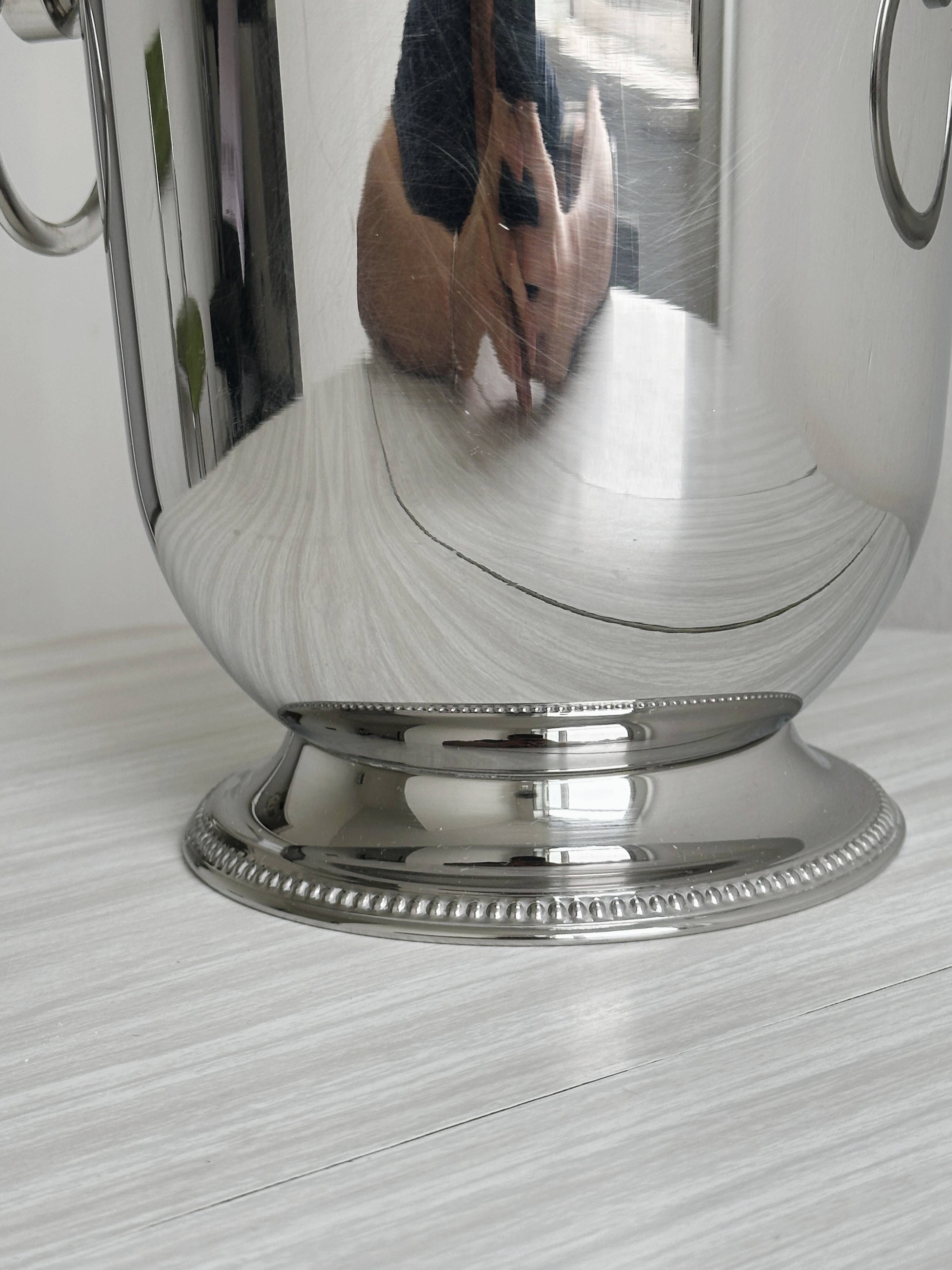 Shiny silver metal champagne bucket