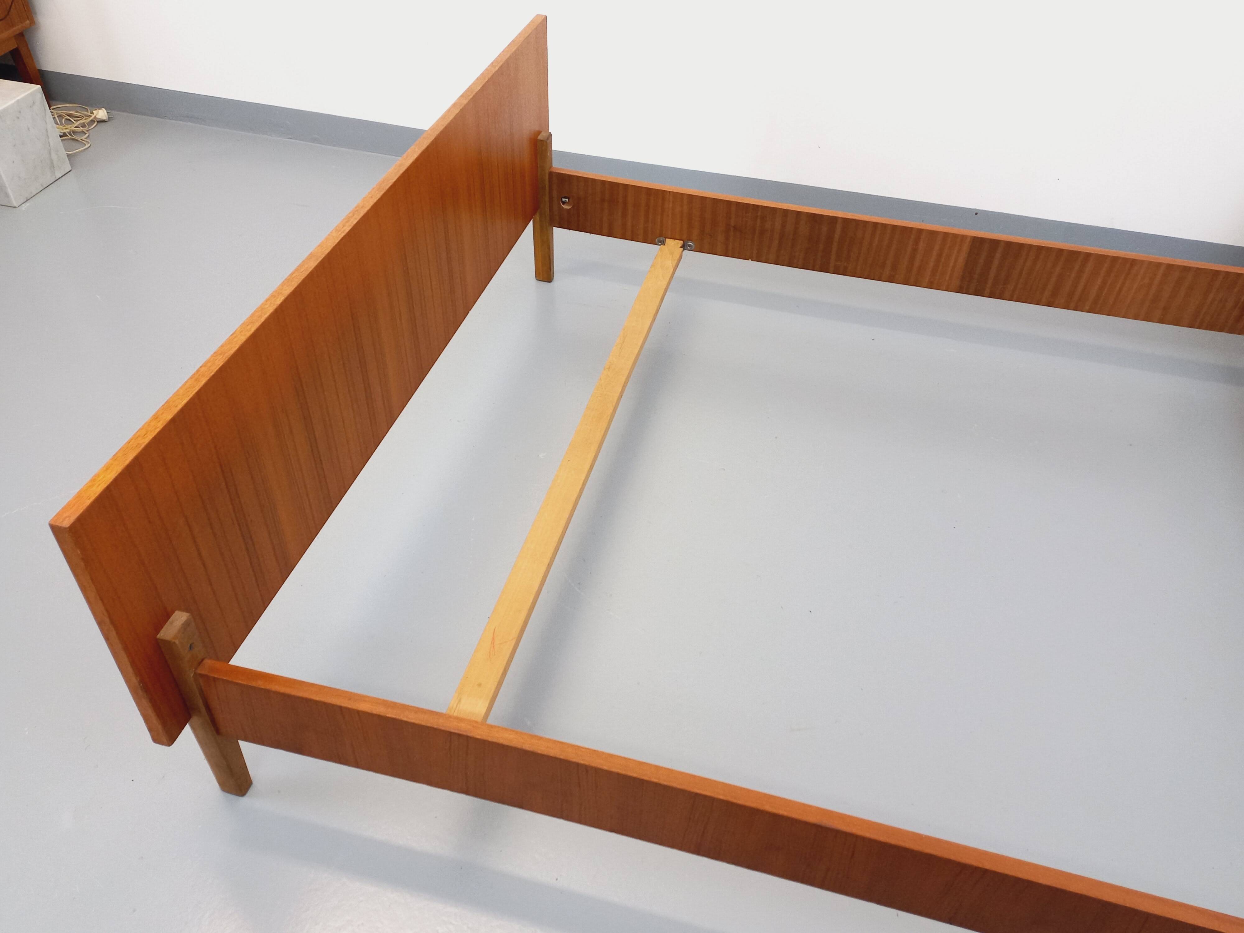 Vintage Scandinavian style double bed in teak from the 60s with integrated bedside lights