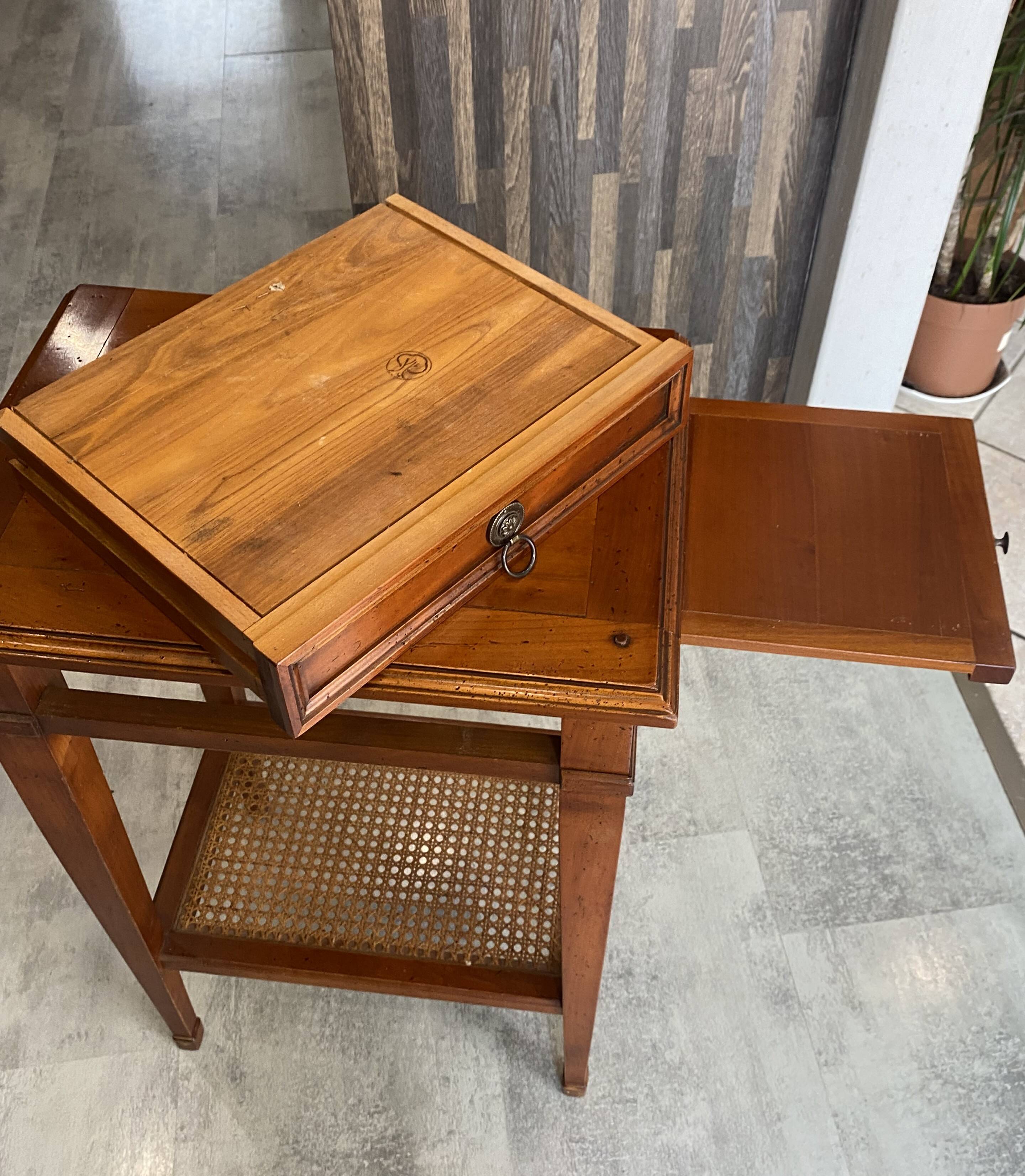 Occasional table in cherry wood, 1 drawer, 1 cane shelf, 1950.