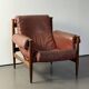 Fauteuil Amiral d'Eric Merthen, en cuir et palissandre
