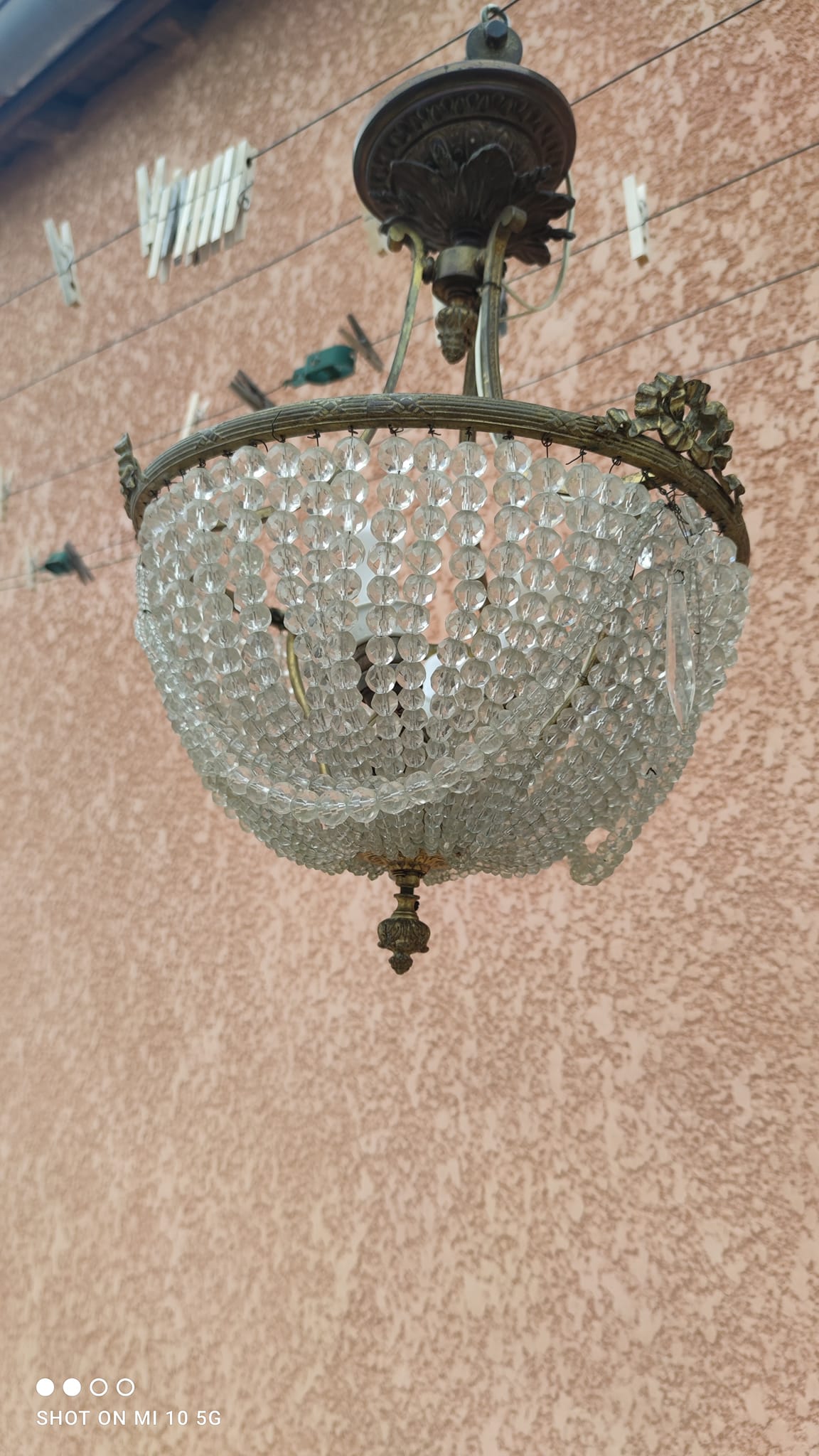 Antique bronze and crystal chandelier, formerly gas-powered, dating from the late 19th century.