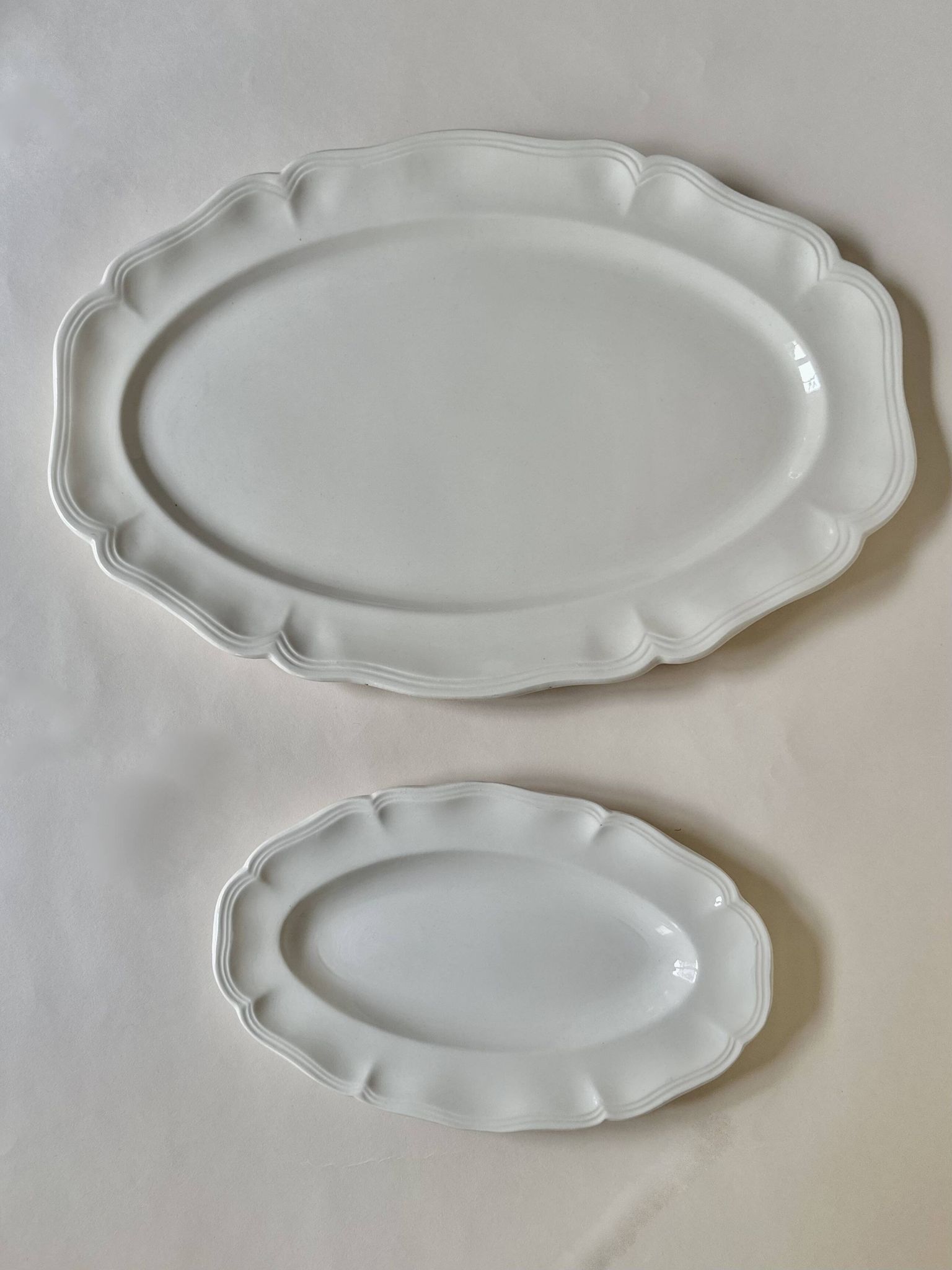 Shaped plates and dishes in Sarreguemines earthenware.