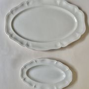 Shaped plates and dishes in Sarreguemines earthenware.