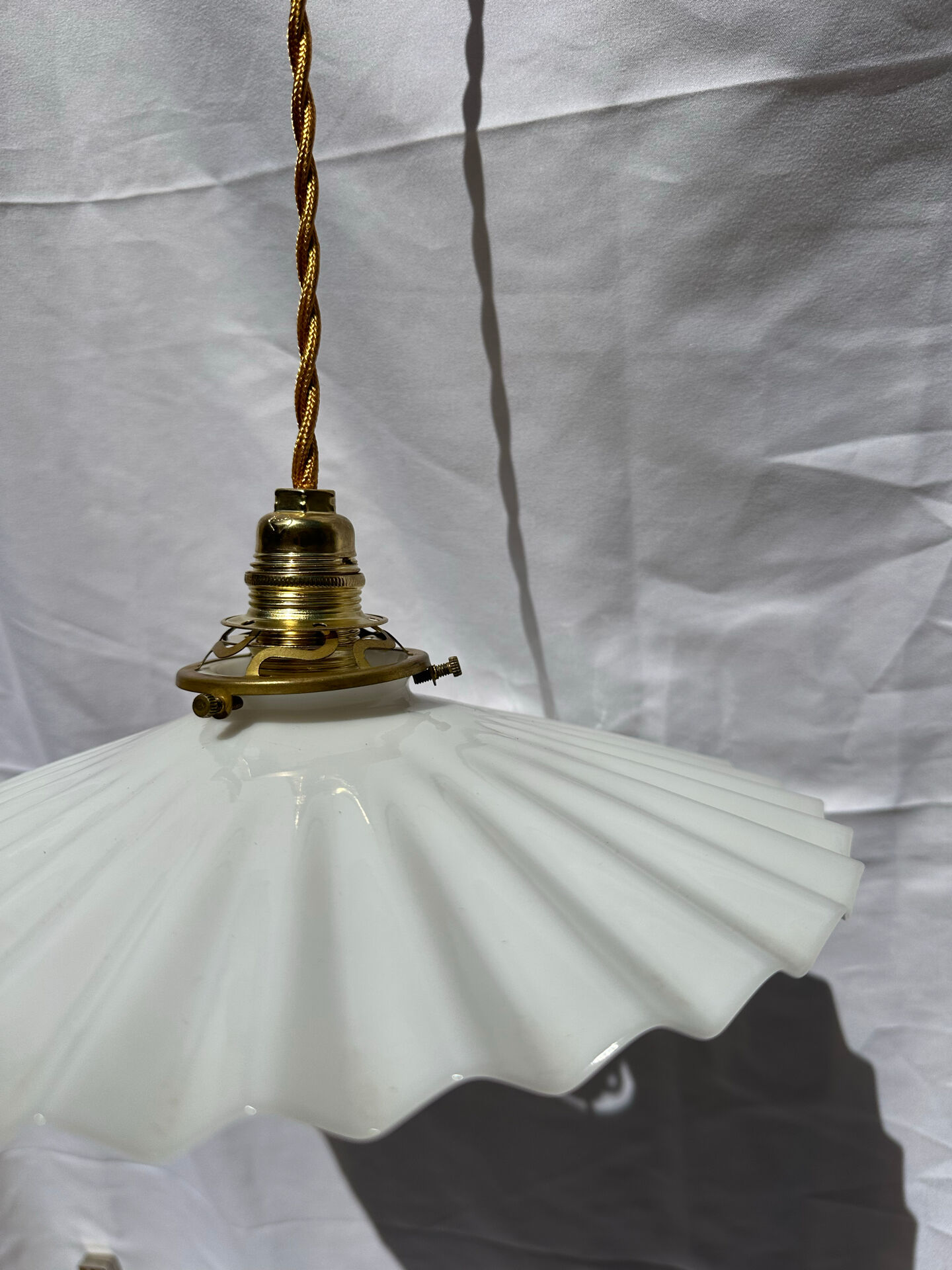 Vintage suspension opaline pleated lampshade with golden threads and claw socket.