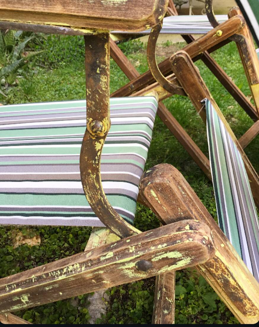 Pair of 19th-century wooden deck chairs with pegged frames and wrought iron