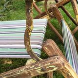 Pair of 19th-century wooden deck chairs with pegged frames and wrought iron